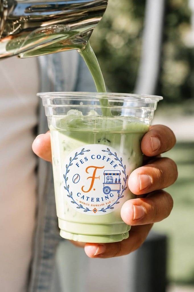 Matcha poured into a Fes Coffee Catering branded cup