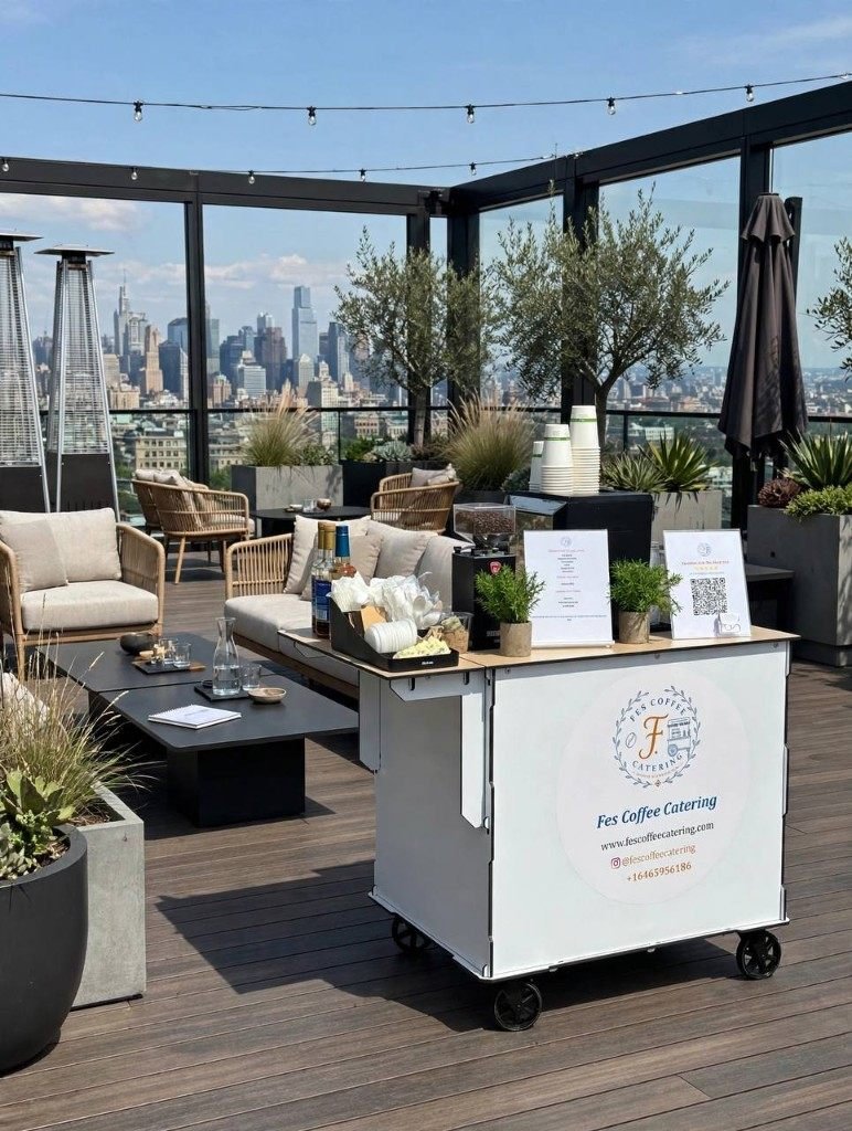 Fes Coffee cart set up on a rooftop terrace with the city skyline