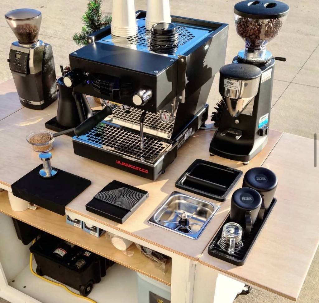 Latte art in Fes Coffee branded cup at corporate event