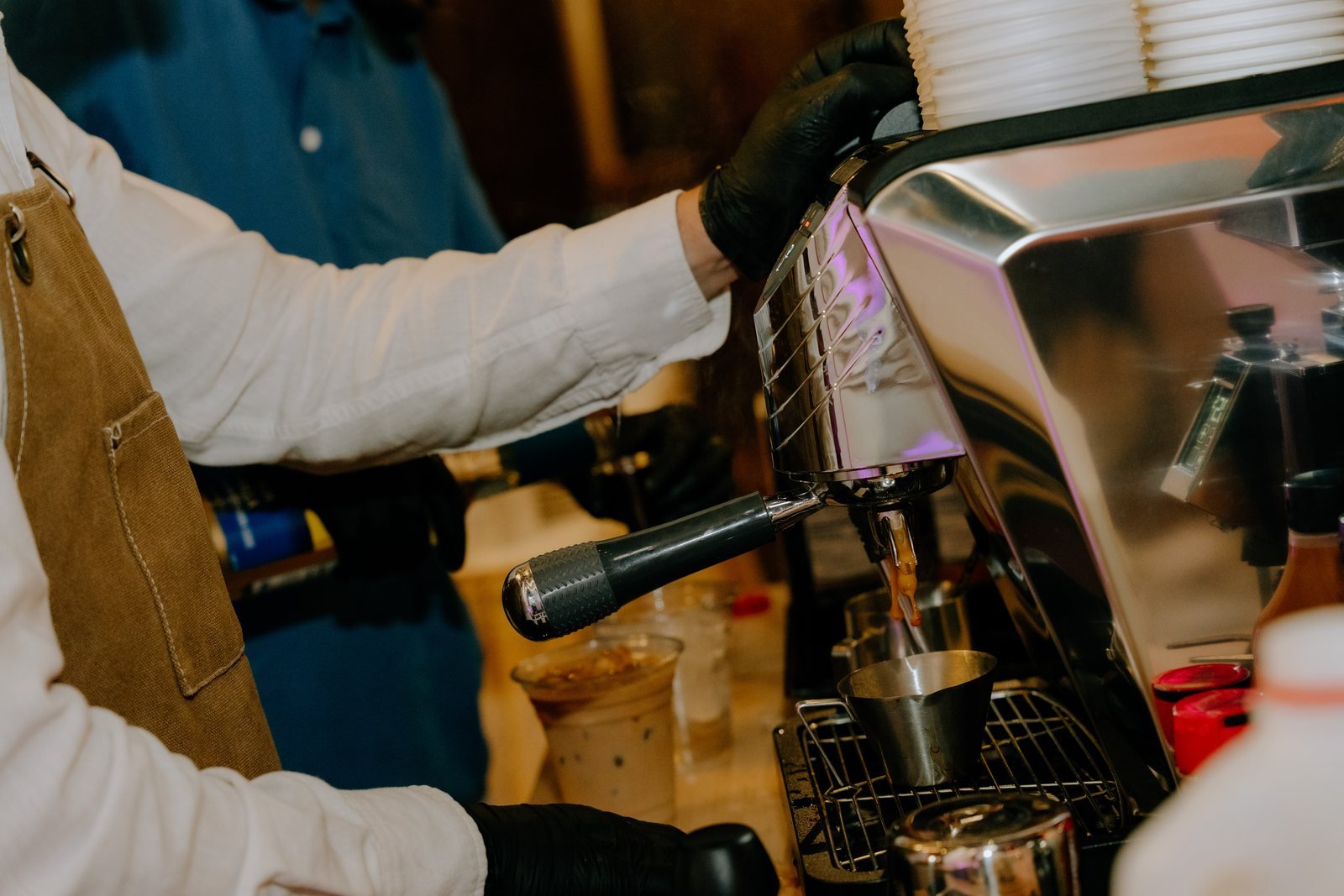 Close-up of a barista pulling an espresso shot on the Fes Coffee espresso machine