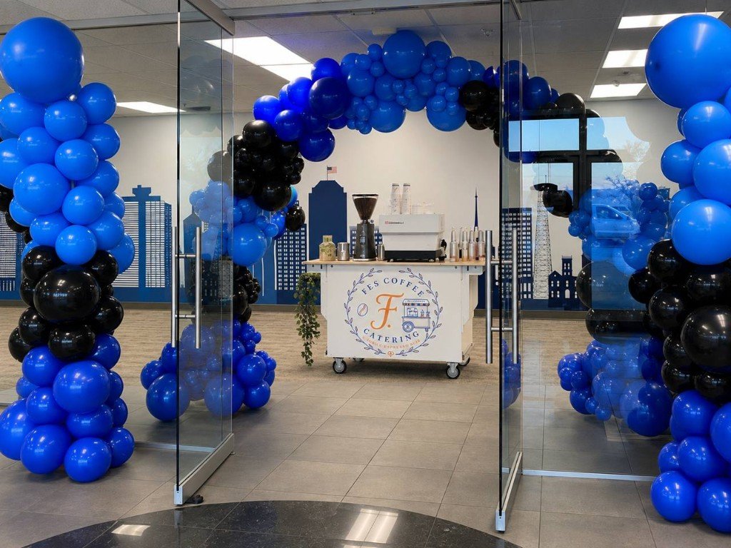 Fes Coffee espresso cart with blue balloon arch at event