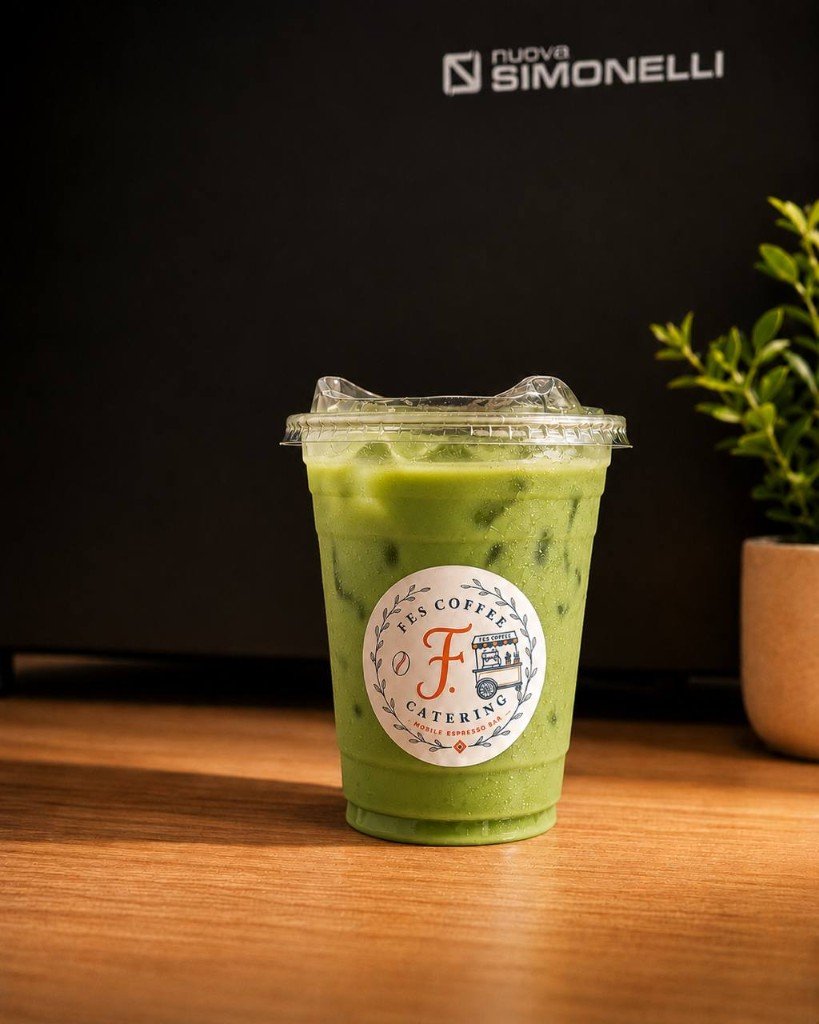 Iced matcha latte in Fes Coffee branded cup