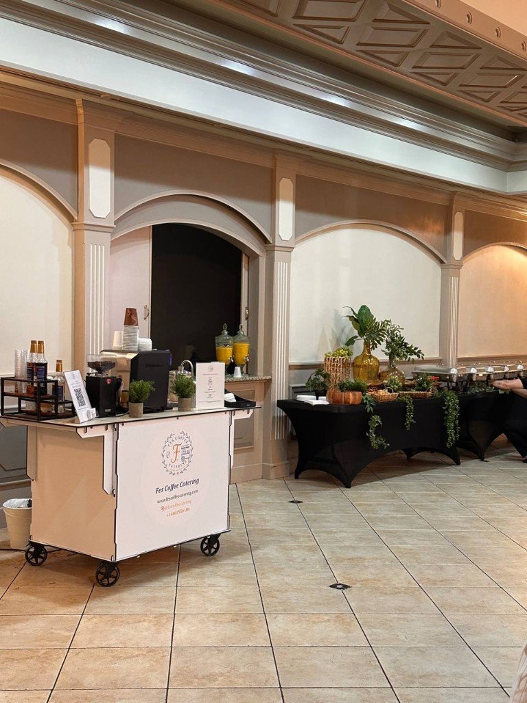 Fes Coffee cart at elegant indoor ballroom catering setup