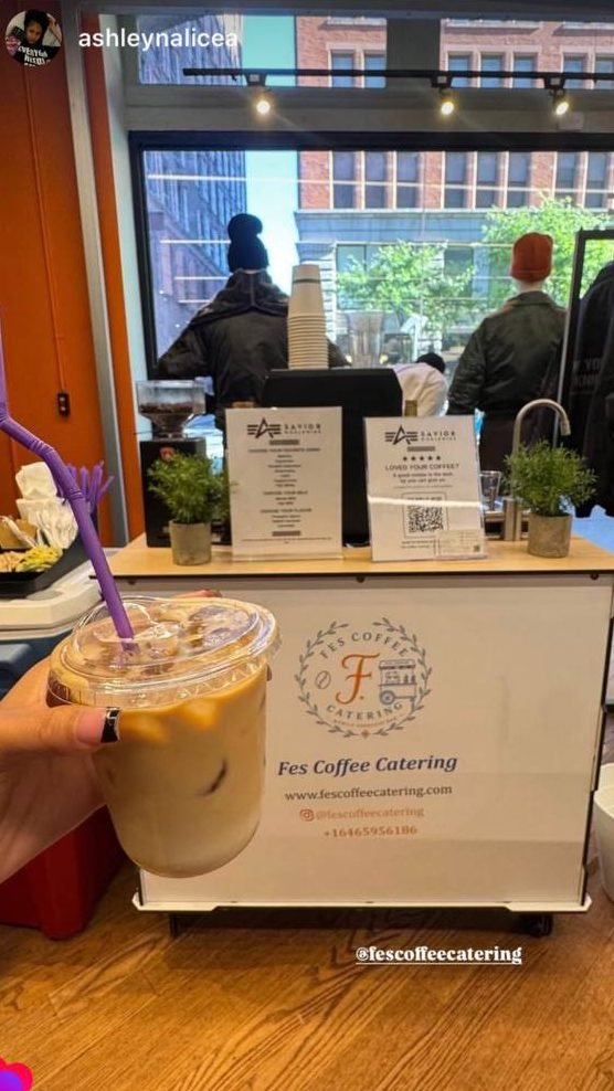 Instagram story of an iced latte held up in front of the Fes Coffee cart, tagged #fescoffeecatering