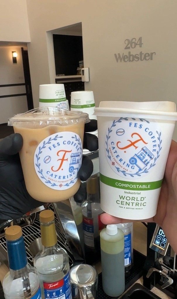Iced latte and hot Fes Coffee cup at the espresso station