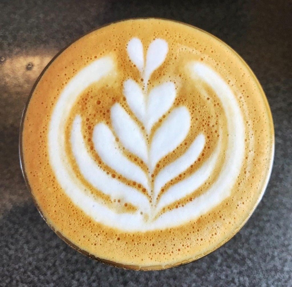 Close-up of rosetta latte art from the Fes Coffee cart