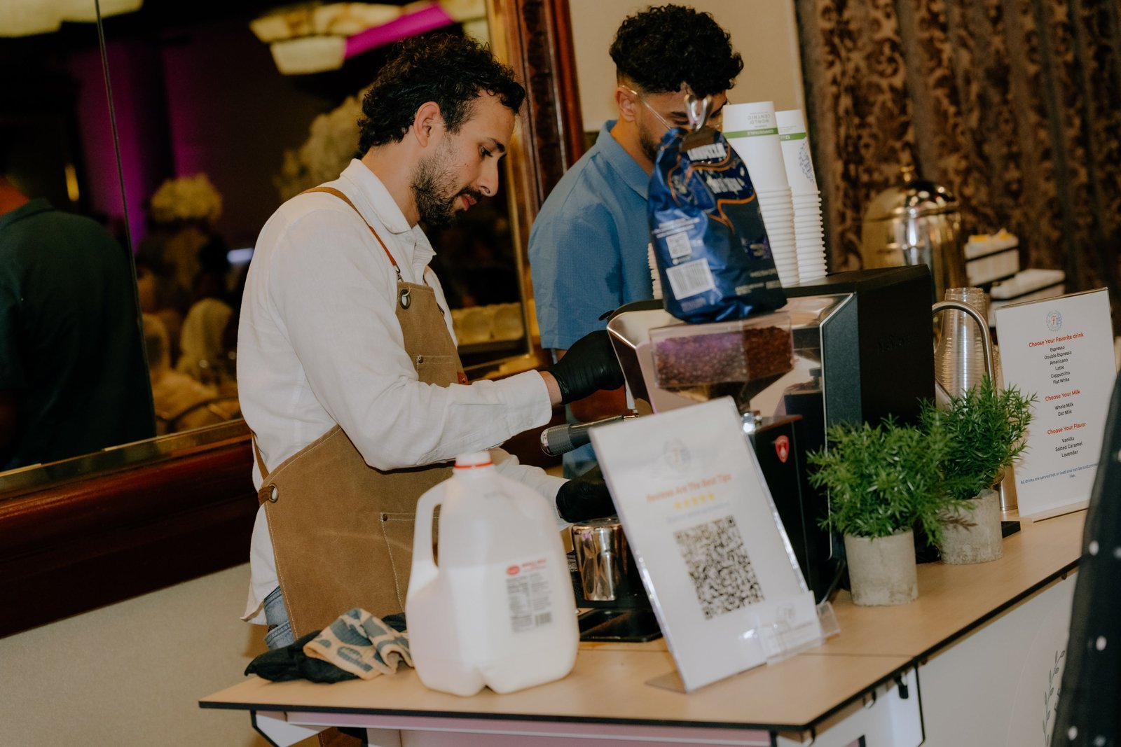 Barista at the Fes Coffee cart pouring espresso
