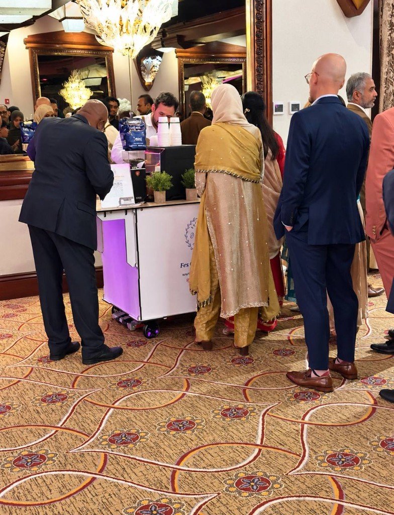Guests at Fes Coffee cart during wedding ballroom reception